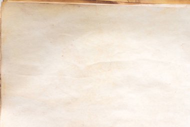 Aged paper sheet. Blank old background with dust and dirty stains. Vintage and antique art concept. Poster mockup. Detailed closeup studio shot. Front view. Toned
