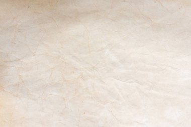 Aged paper sheet. Blank old background with dust and dirty stains. Vintage and antique art concept. Poster mockup. Detailed closeup studio shot. Front view. Toned