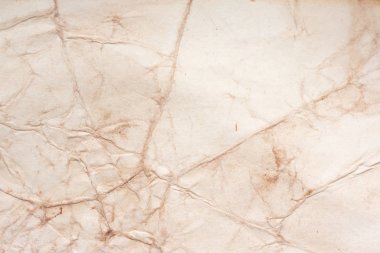 Aged paper sheet. Blank old background with dust and dirty stains. Vintage and antique art concept. Poster mockup. Detailed closeup studio shot. Front view. Toned