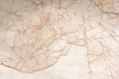 Aged paper sheet. Blank old background with dust and dirty stains. Vintage and antique art concept. Poster mockup. Detailed closeup studio shot. Front view. Toned