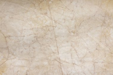 Aged paper sheet. Blank old background with dust and dirty stains. Vintage and antique art concept. Poster mockup. Detailed closeup studio shot. Front view. Toned