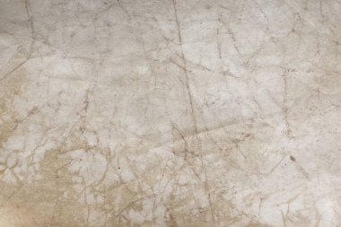 Aged paper sheet. Blank old background with dust and dirty stains. Vintage and antique art concept. Poster mockup. Detailed closeup studio shot. Front view. Toned