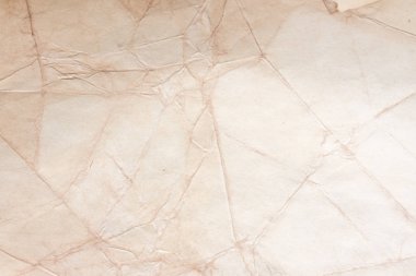 Aged paper sheet. Blank old background with dust and dirty stains. Vintage and antique art concept. Poster mockup. Detailed closeup studio shot. Front view. Toned