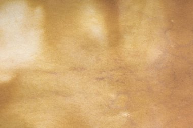 Aged paper sheet. Blank old background with dust and dirty stains. Vintage and antique art concept. Poster mockup. Detailed closeup studio shot. Front view. Toned