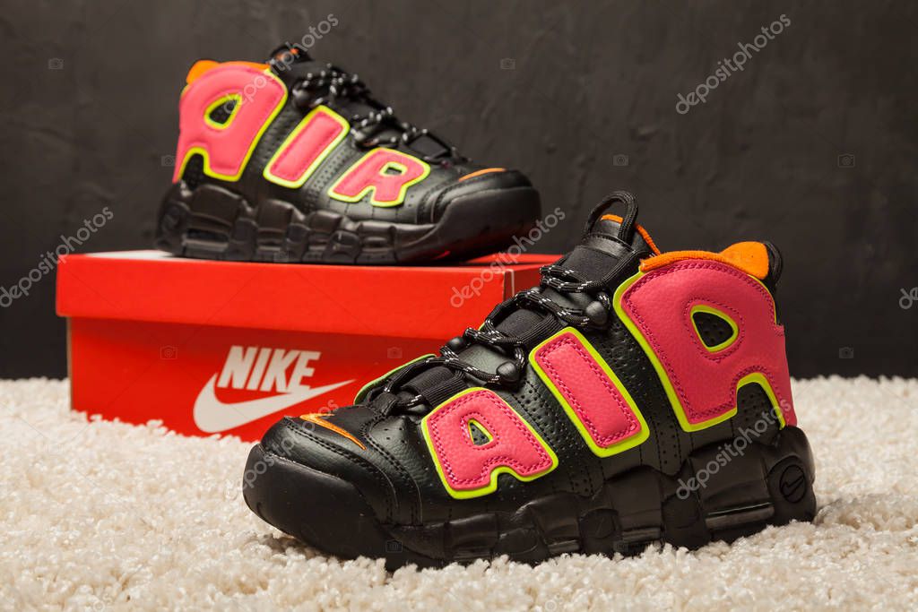 New beautiful colorful and nice Nike Air Max running shoes, sneakers, trainers shows the logo with a brand box on abstract background. Sport and casual footwear concept. Kyiv, Ukraine-August 21, 2018