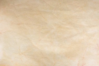 Aged paper sheet. Blank old background with dust and dirty stains. Vintage and antique art concept. Poster mockup. Detailed closeup studio shot. Front view. Toned