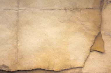 Aged paper sheet. Blank old background with dust and dirty stains. Vintage and antique art concept. Poster mockup. Detailed closeup studio shot. Front view. Toned