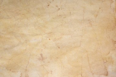 Aged paper sheet. Blank old background with dust and dirty stains. Vintage and antique art concept. Poster mockup. Detailed closeup studio shot. Front view. Toned