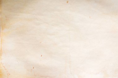Aged paper sheet. Blank old background with dust and dirty stains. Vintage and antique art concept. Poster mockup. Detailed closeup studio shot. Front view. Toned