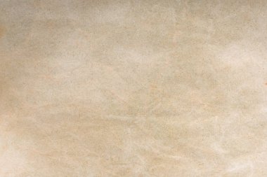 Aged paper sheet. Blank old background with dust and dirty stains. Vintage and antique art concept. Poster mockup. Detailed closeup studio shot. Front view. Toned