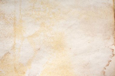 Aged paper sheet. Blank old background with dust and dirty stains. Vintage and antique art concept. Poster mockup. Detailed closeup studio shot. Front view. Toned