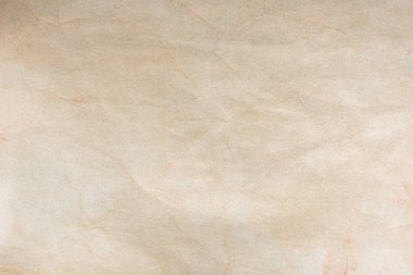 Aged paper sheet. Blank old background with dust and dirty stains. Vintage and antique art concept. Poster mockup. Detailed closeup studio shot. Front view. Toned