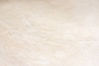 Aged paper sheet. Blank old background with dust and dirty stains. Vintage and antique art concept. Poster mockup. Detailed closeup studio shot. Front view. Toned