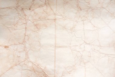 Aged paper sheet. Blank old background with dust and dirty stains. Vintage and antique art concept. Poster mockup. Detailed closeup studio shot. Front view. Toned