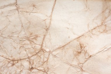 Aged paper sheet. Blank old background with dust and dirty stains. Vintage and antique art concept. Poster mockup. Detailed closeup studio shot. Front view. Toned