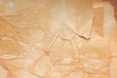 Aged paper sheet. Blank old background with dust and dirty stains. Vintage and antique art concept. Poster mockup. Detailed closeup studio shot. Front view. Toned