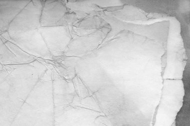 Eski kağıt çarşaf. Toz ve kirli lekelerle dolu boş bir arka plan. Eski ve antika sanat konsepti. Ayrıntılı yakın çekim stüdyo çekimi. Ön manzara. Ayarlanmış