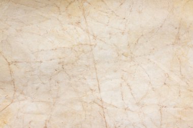 Aged paper sheet. Blank old background with dust and dirty stains. Vintage and antique art concept. Poster mockup. Detailed closeup studio shot. Front view. Toned