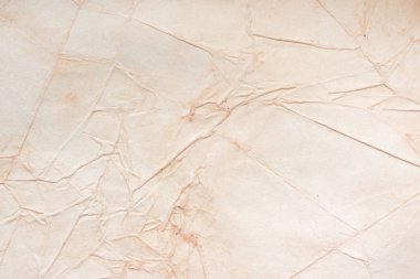 Aged paper sheet. Blank old background with dust and dirty stains. Vintage and antique art concept. Poster mockup. Detailed closeup studio shot. Front view. Toned