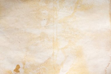 Aged paper sheet. Blank old background with dust and dirty stains. Vintage and antique art concept. Poster mockup. Detailed closeup studio shot. Front view. Toned