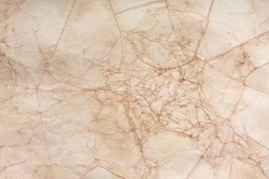 Aged paper sheet. Blank old background with dust and dirty stains. Vintage and antique art concept. Poster mockup. Detailed closeup studio shot. Front view. Toned