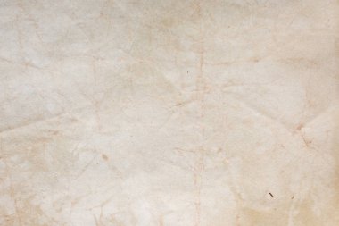 Aged paper sheet. Blank old background with dust and dirty stains. Vintage and antique art concept. Poster mockup. Detailed closeup studio shot. Front view. Toned