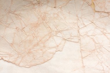 Aged paper sheet. Blank old background with dust and dirty stains. Vintage and antique art concept. Poster mockup. Detailed closeup studio shot. Front view. Toned