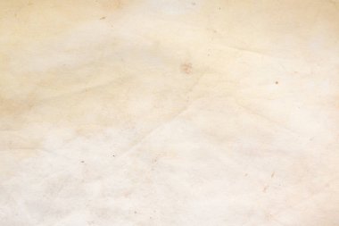 Aged paper sheet. Blank old background with dust and dirty stains. Vintage and antique art concept. Poster mockup. Detailed closeup studio shot. Front view. Toned