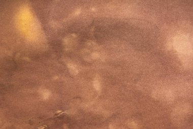 Aged paper sheet. Blank old background with dust and dirty stains. Vintage and antique art concept. Poster mockup. Detailed closeup studio shot. Front view. Toned