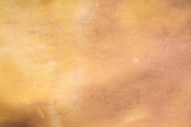 Aged paper sheet. Blank old background with dust and dirty stains. Vintage and antique art concept. Poster mockup. Detailed closeup studio shot. Front view. Toned