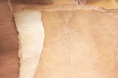 Aged paper sheet. Blank old background with dust and dirty stains. Vintage and antique art concept. Poster mockup. Detailed closeup studio shot. Front view. Toned