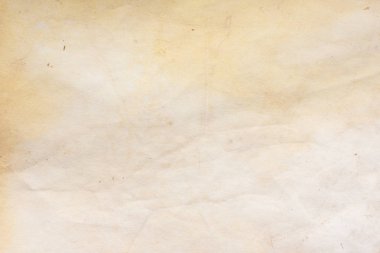 Aged paper sheet. Blank old background with dust and dirty stains. Vintage and antique art concept. Poster mockup. Detailed closeup studio shot. Front view. Toned