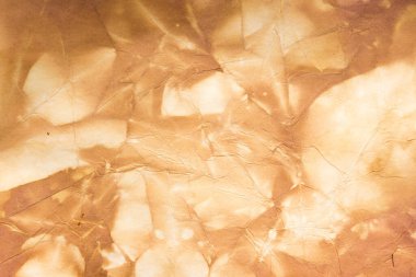 Aged paper sheet. Blank old background with dust and dirty stains. Vintage and antique art concept. Poster mockup. Detailed closeup studio shot. Front view. Toned