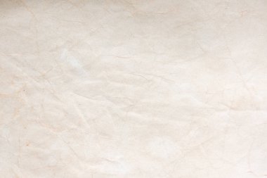 Aged paper sheet. Blank old background with dust and dirty stains. Vintage and antique art concept. Poster mockup. Detailed closeup studio shot. Front view. Toned