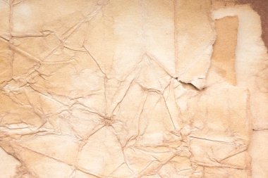 Aged paper sheet. Blank old background with dust and dirty stains. Vintage and antique art concept. Poster mockup. Detailed closeup studio shot. Front view. Toned