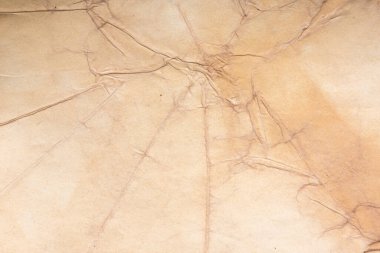 Aged paper sheet. Blank old background with dust and dirty stains. Vintage and antique art concept. Poster mockup. Detailed closeup studio shot. Front view. Toned