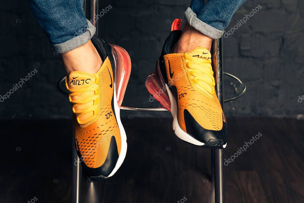 New beautiful colorful and nice Nike Air Max running shoes, sneakers, trainers shows the logo with a brand box on abstract background. Sport and casual footwear concept. Kyiv, Ukraine-August 26, 2018