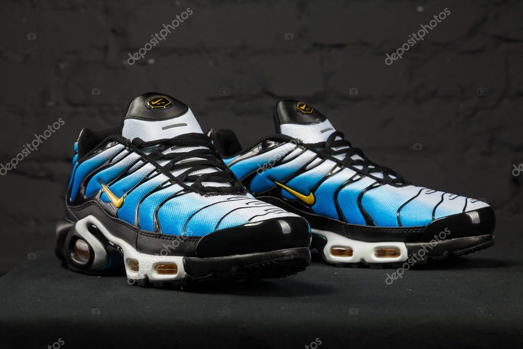 New beautiful colorful and nice Nike Air Max running shoes, sneakers, trainers shows the logo with a brand box on abstract background. Sport and casual footwear concept. Kyiv, Ukraine-February 8, 2018