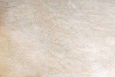 Aged paper sheet. Blank old background with dust and dirty stains. Vintage and antique art concept. Poster mockup. Detailed closeup studio shot. Front view. Toned