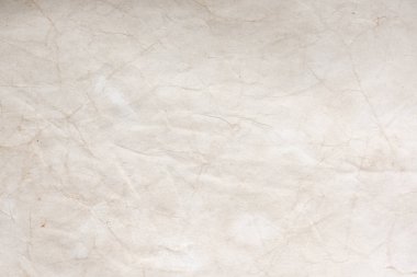 Aged paper sheet. Blank old background with dust and dirty stains. Vintage and antique art concept. Poster mockup. Detailed closeup studio shot. Front view. Toned