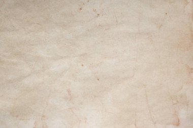 Aged paper sheet. Blank old background with dust and dirty stains. Vintage and antique art concept. Poster mockup. Detailed closeup studio shot. Front view. Toned