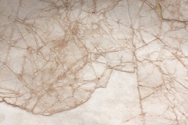 Aged paper sheet. Blank old background with dust and dirty stains. Vintage and antique art concept. Poster mockup. Detailed closeup studio shot. Front view. Toned