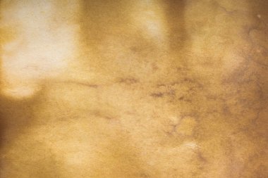 Aged paper sheet. Blank old background with dust and dirty stains. Vintage and antique art concept. Poster mockup. Detailed closeup studio shot. Front view. Toned