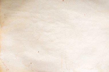 Aged paper sheet. Blank old background with dust and dirty stains. Vintage and antique art concept. Poster mockup. Detailed closeup studio shot. Front view. Toned