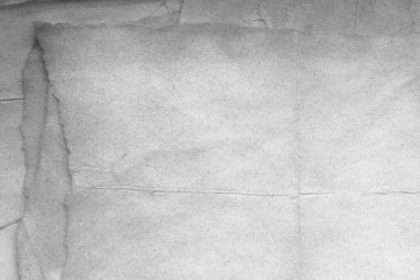 Eski kağıt çarşaf. Toz ve kirli lekelerle dolu boş bir arka plan. Eski ve antika sanat konsepti. Ayrıntılı yakın çekim stüdyo çekimi. Ön manzara. Ayarlanmış