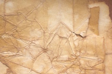 Aged paper sheet. Blank old background with dust and dirty stains. Vintage and antique art concept. Poster mockup. Detailed closeup studio shot. Front view. Toned