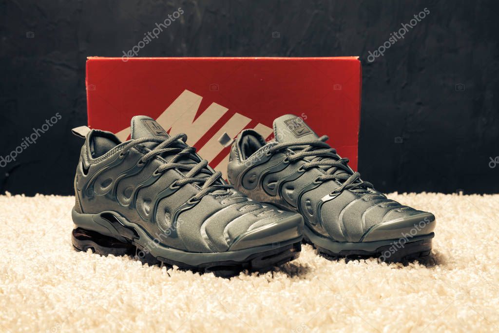 New beautiful colorful and nice Nike Air Max running shoes, sneakers, trainers shows the logo with a brand box on abstract background. Sport and casual footwear concept. Kyiv, Ukraine-August 23, 2018