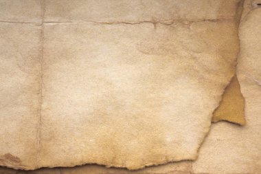 Aged paper sheet. Blank old background with dust and dirty stains. Vintage and antique art concept. Poster mockup. Detailed closeup studio shot. Front view. Toned