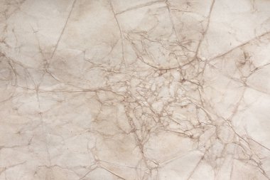 Aged paper sheet. Blank old background with dust and dirty stains. Vintage and antique art concept. Poster mockup. Detailed closeup studio shot. Front view. Toned