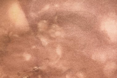 Aged paper sheet. Blank old background with dust and dirty stains. Vintage and antique art concept. Poster mockup. Detailed closeup studio shot. Front view. Toned